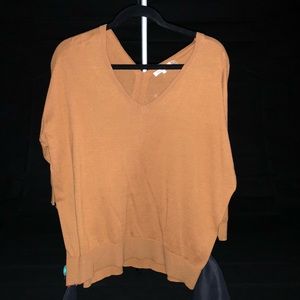 Lightweight pumpkin-hued V neck.